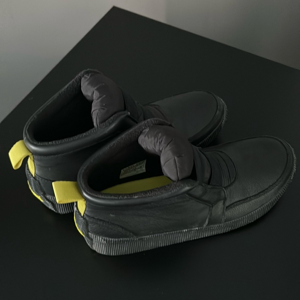 SOREL ‘Out N About’ mid rise leather sneaker/bootie with rubber sole. Black.